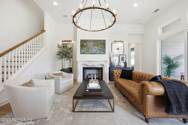 a view of a livingroom with furniture and a window