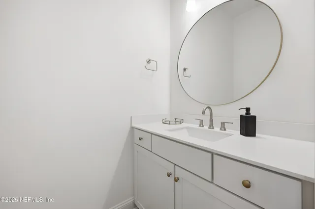 a living room with furniture a lamp a rug and a window