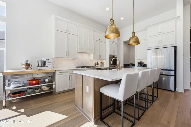 a living room with furniture a lamp a rug and a large window