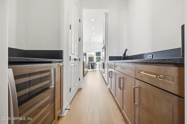 a view of a storage and utility room with washer and dryer