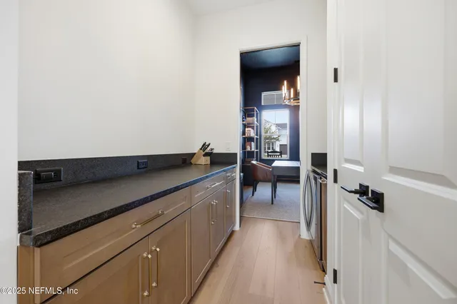a living room with furniture potted plant and a window