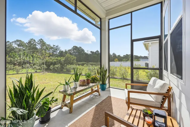an aerial view of a house with a big yard