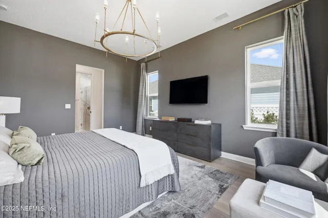 an aerial view of residential houses with outdoor space and swimming pool