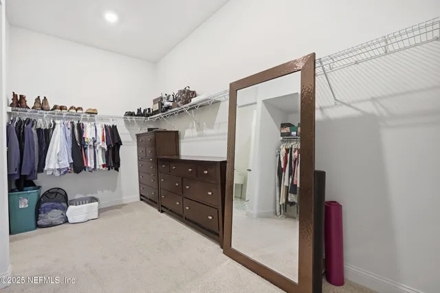 an aerial view of residential house with outdoor space and swimming pool