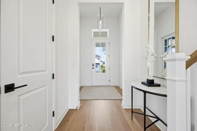 a view of a dining room with a table and chairs