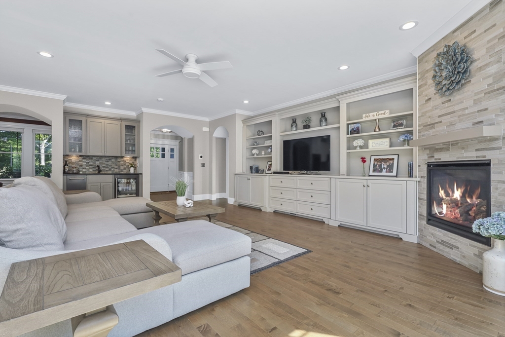 23 September Drive Franklin, MA 02038 - Photo 15 of 42 a living room with fireplace furniture and a flat screen tv