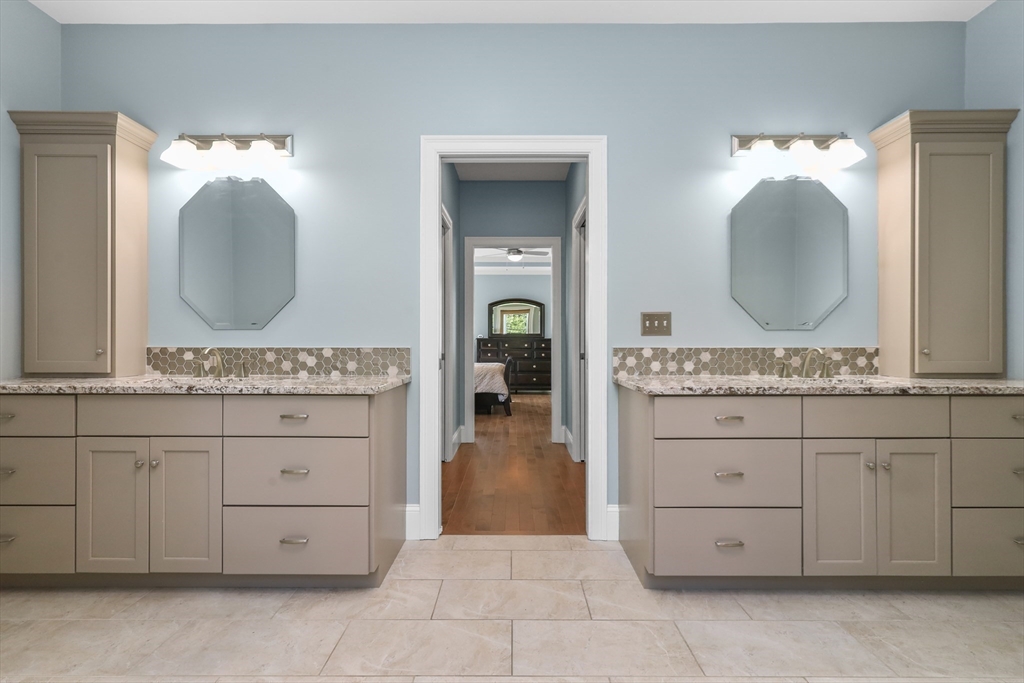 23 September Drive Franklin, MA 02038 - Photo 28 of 42 a bathroom with a double vanity sink and a mirror