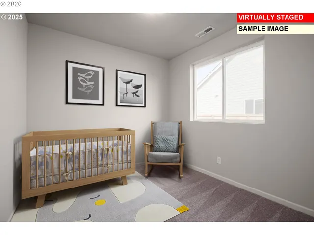 a bedroom with a window and wooden floor
