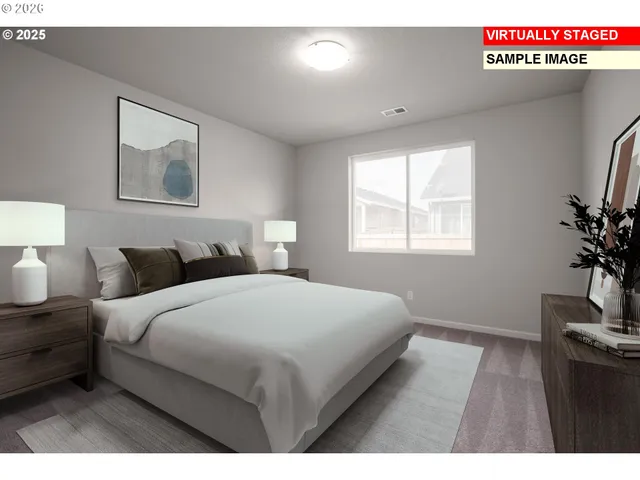 a bedroom with bed and window