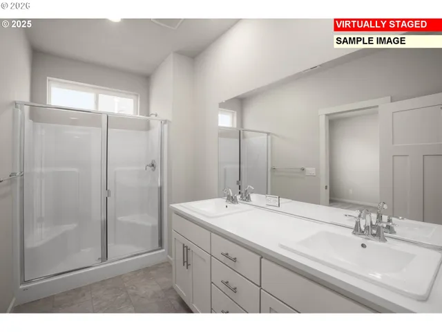 a bathroom with a sink a mirror and a shower