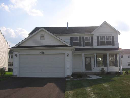 1503 Roth Drive Joliet, IL 60431 - Photo 1 of 1 a front view of a house with a yard