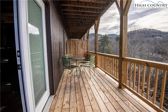 a view of balcony with wooden floor