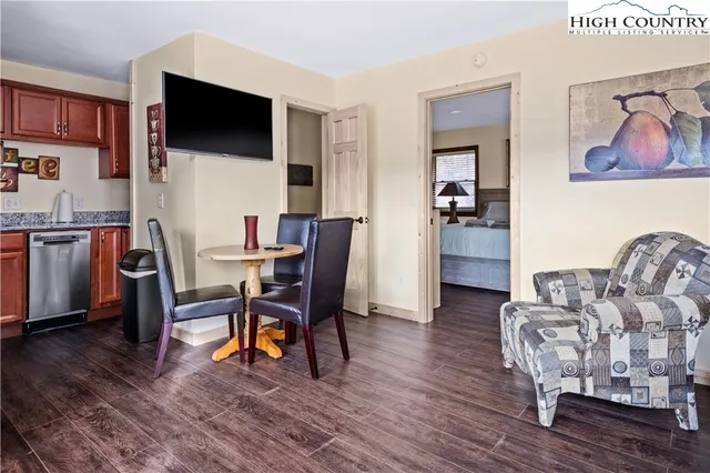 a workspace with furniture and a flat screen tv