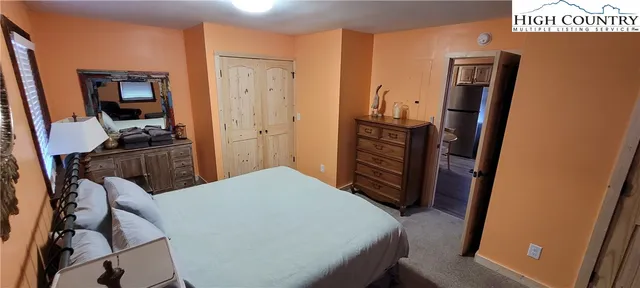 a bedroom with a bed and furniture