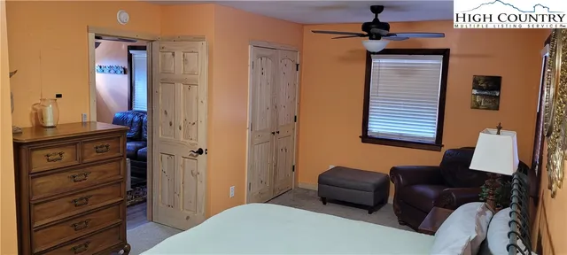a bedroom with a bed and furniture