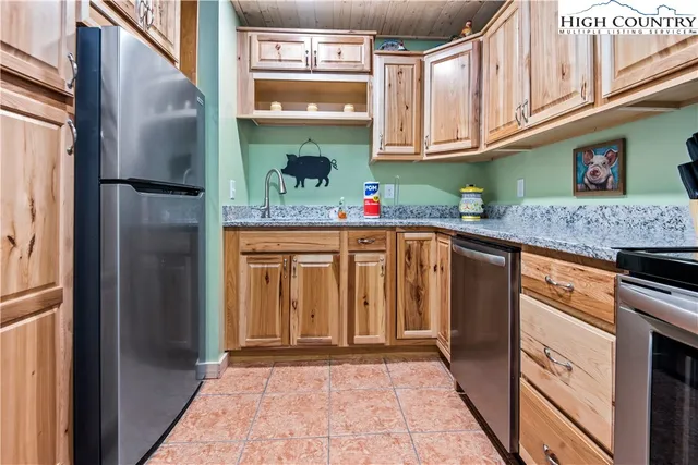 a bedroom with bed and window