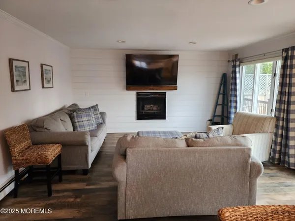 a view of a roof deck with furniture