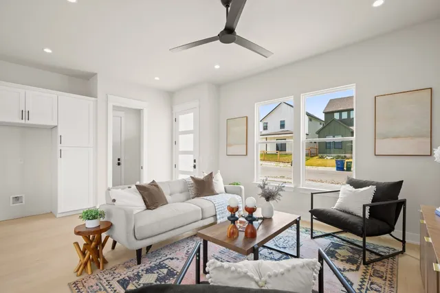a living room with furniture and a large window