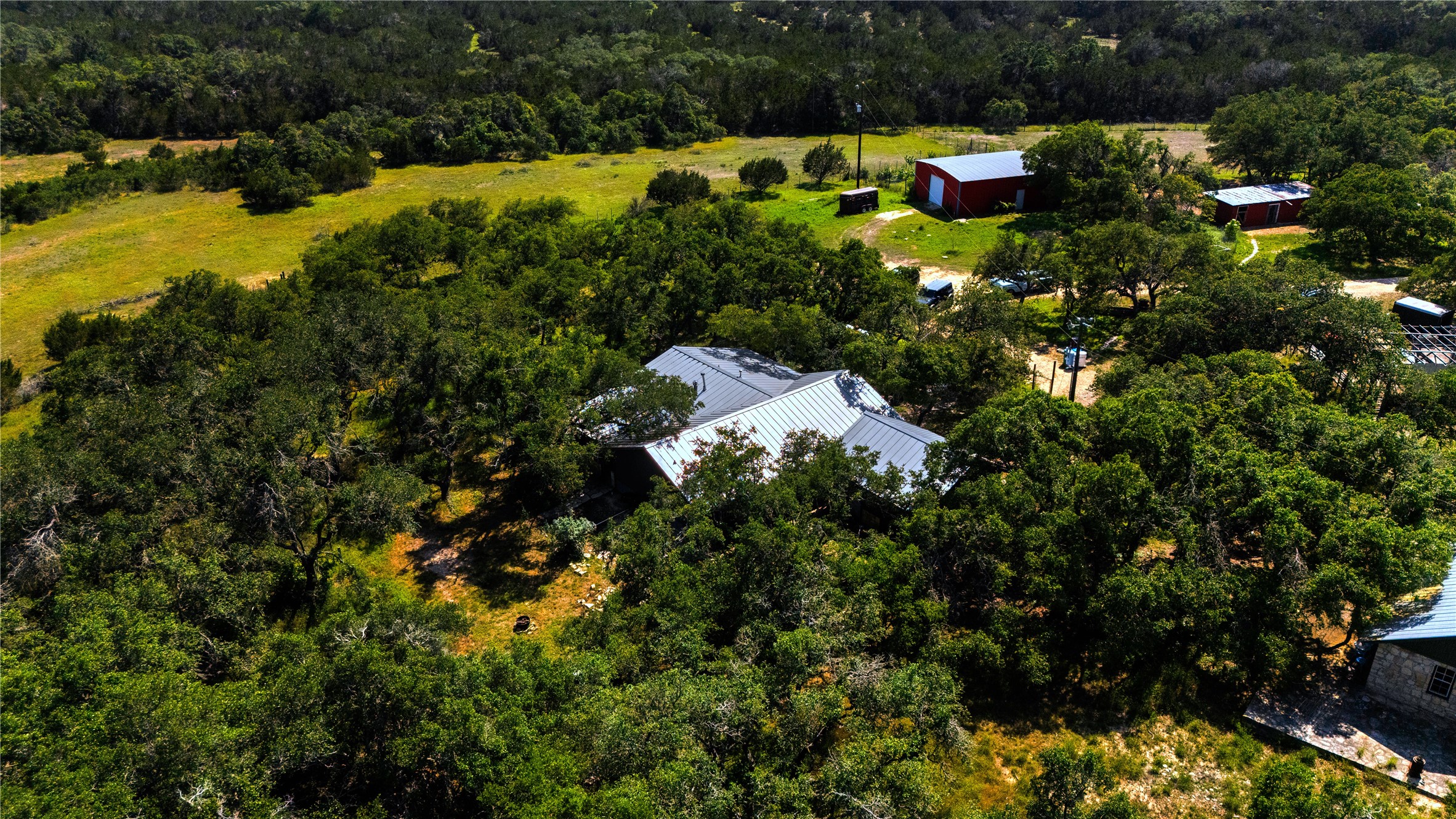 435 Spangenberg Road Blanco, TX 78606 - Photo 6 of 38 a view of a house with a park