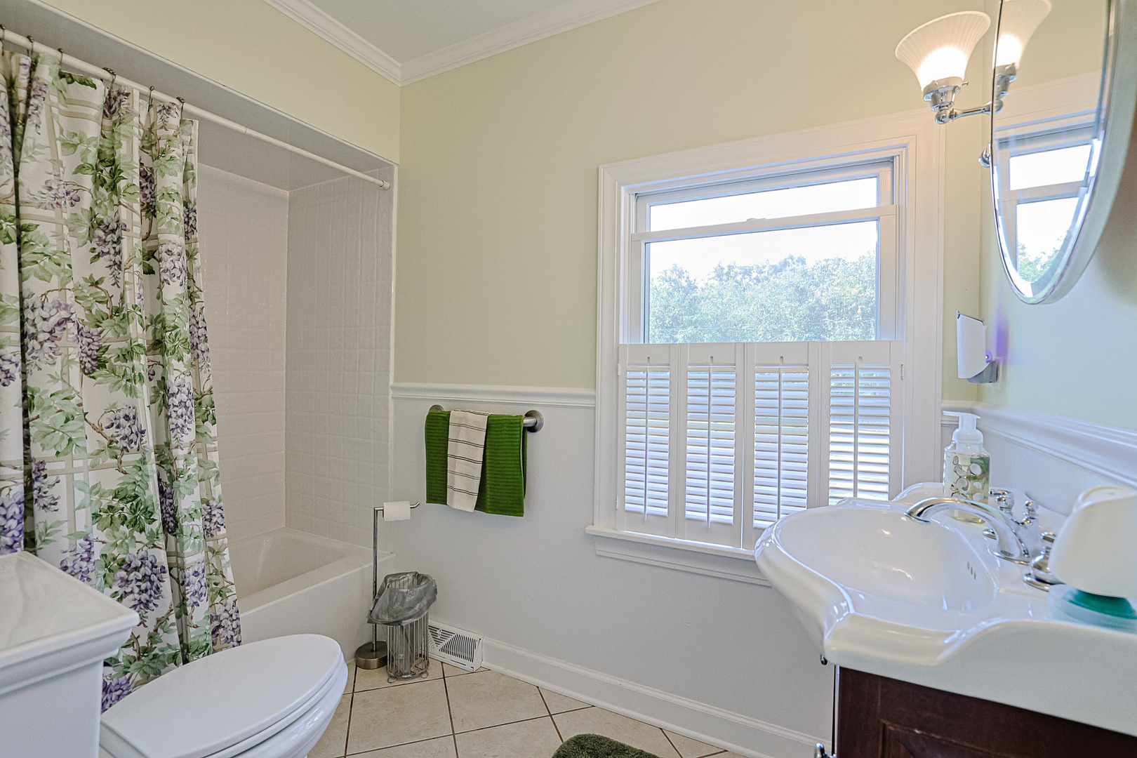 921 Guerin Road Libertyville, IL 60048 - Photo 12 of 43 a bathroom with a sink a toilet a mirror and shower