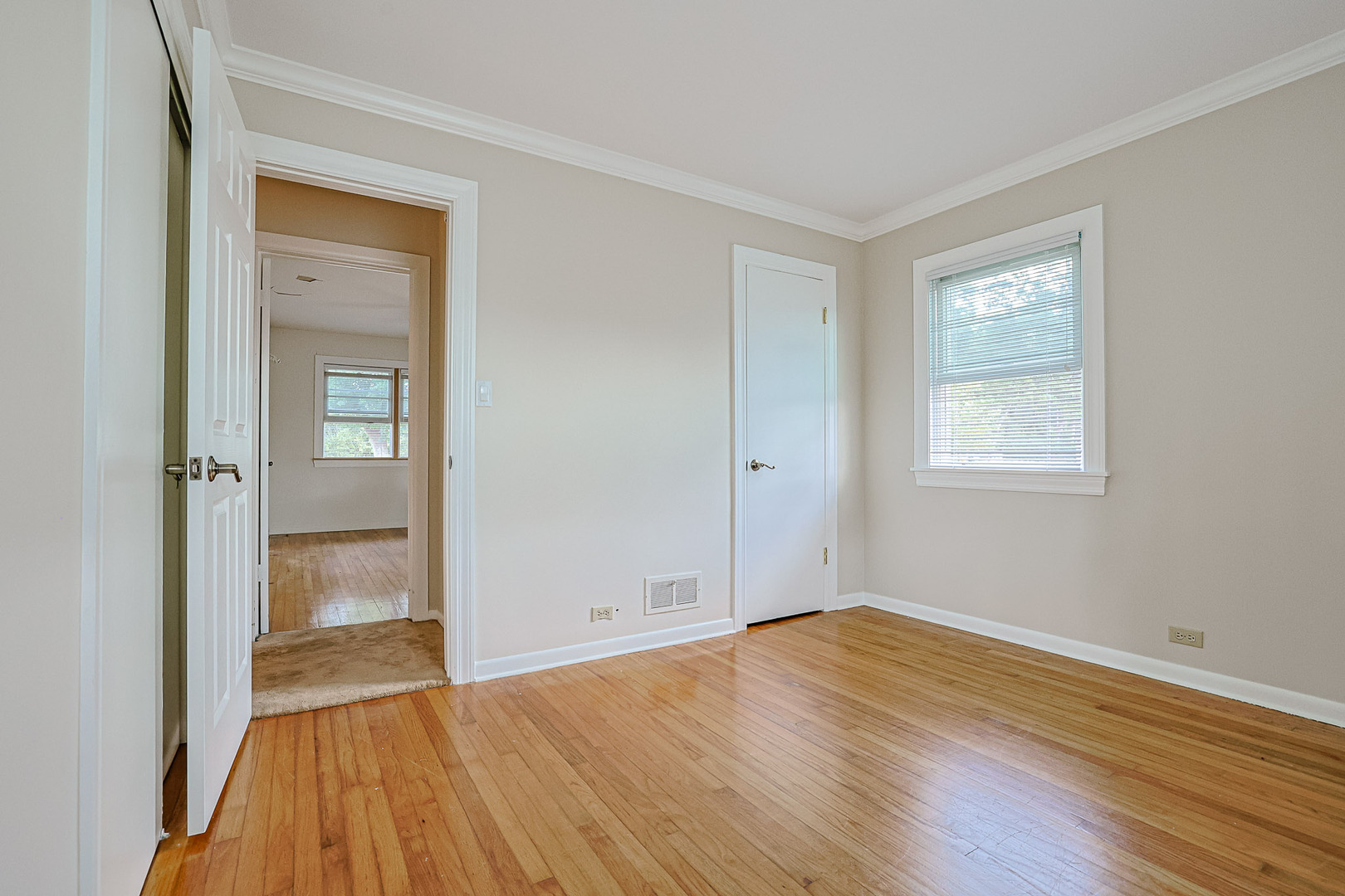 921 Guerin Road Libertyville, IL 60048 - Photo 17 of 43 a view of an empty room with wooden floor and a window
