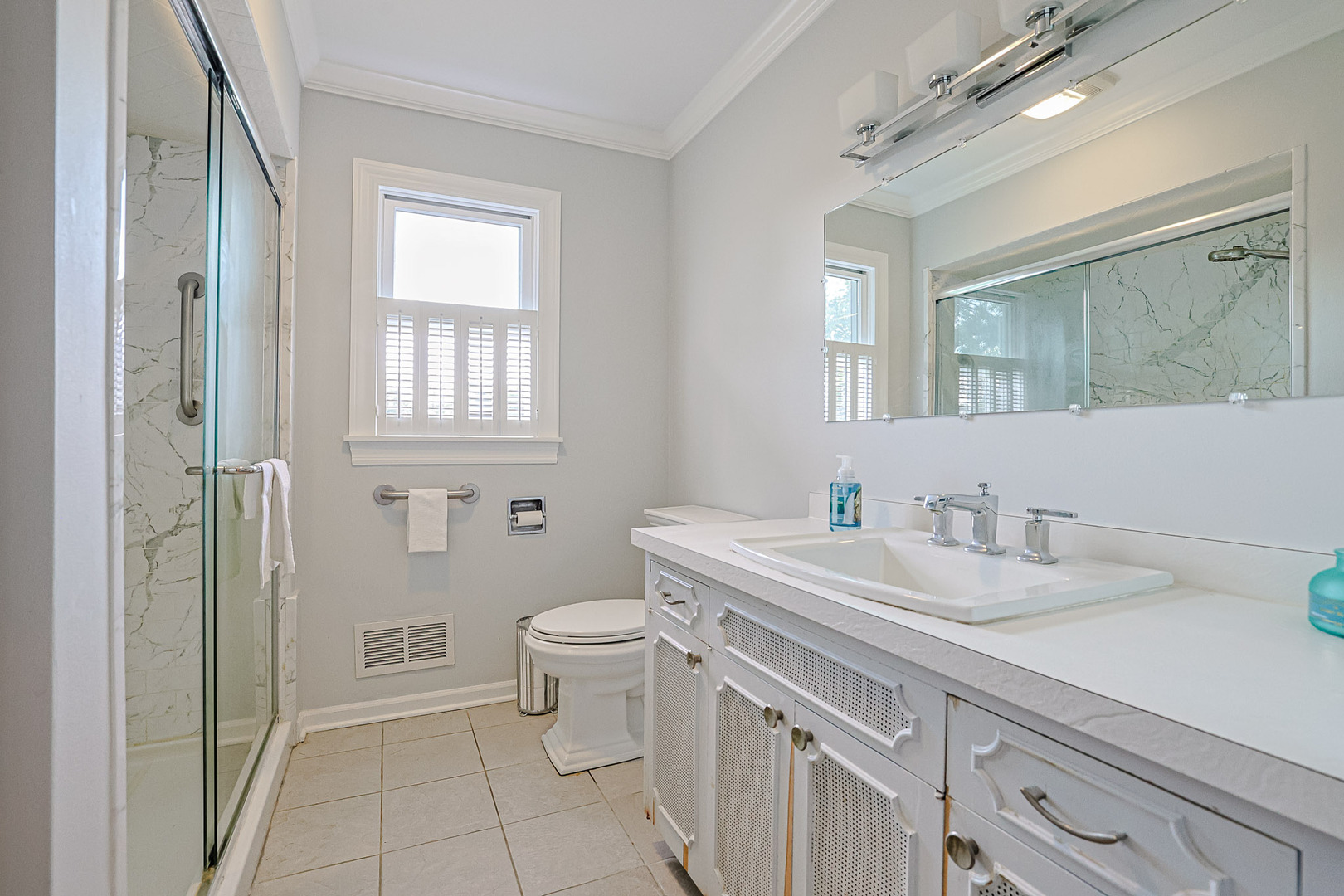 921 Guerin Road Libertyville, IL 60048 - Photo 20 of 43 a bathroom with a sink a toilet and shower