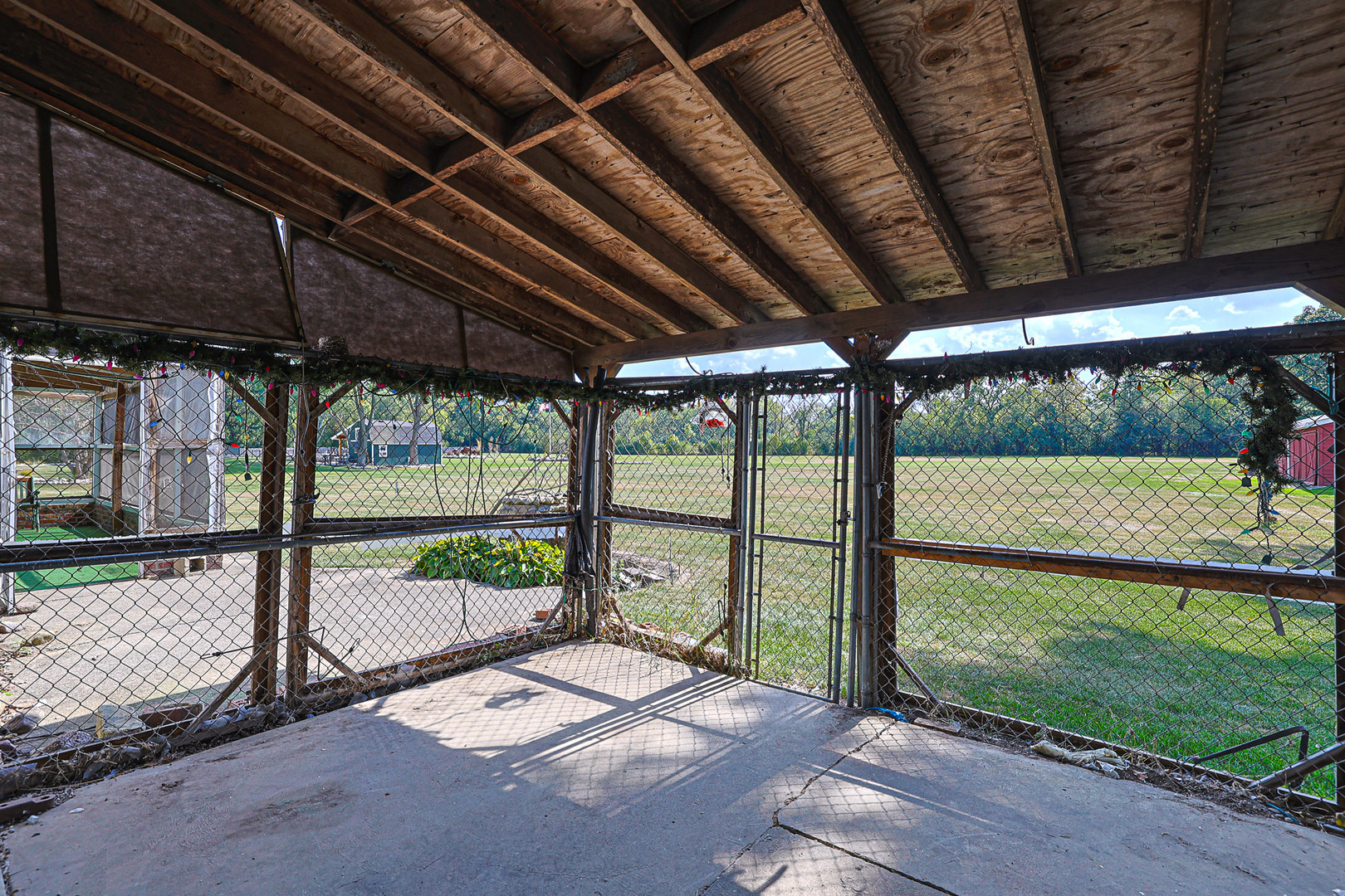 921 Guerin Road Libertyville, IL 60048 - Photo 22 of 43 a view of a porch with wooden floor next to a yard
