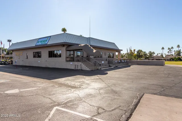 a view of a swimming pool with a lounge chairs