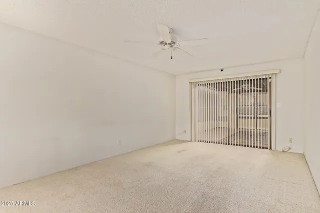 an empty room with fan
