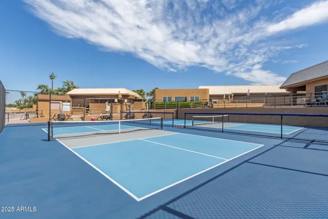 a street sign on a wall next to road