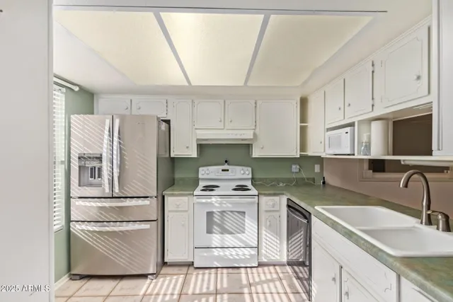 an empty room with a ceiling fan and bathroom