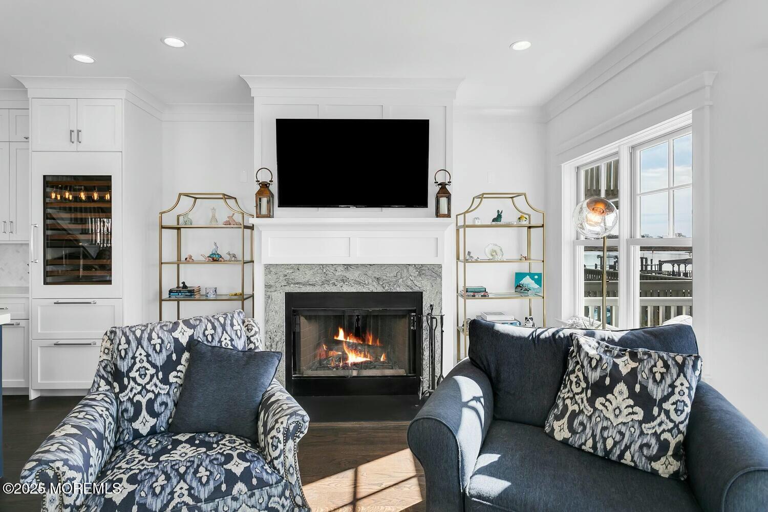 20 Riverview Place Sea Bright, NJ 07760 - Photo 12 of 107 a living room with furniture a flat screen tv and a fireplace