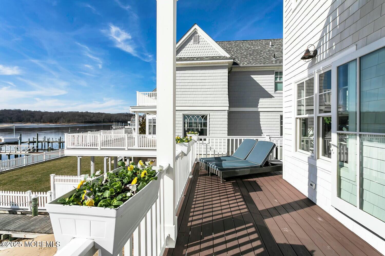 20 Riverview Place Sea Bright, NJ 07760 - Photo 21 of 107 a view of a chair and tables on the roof deck