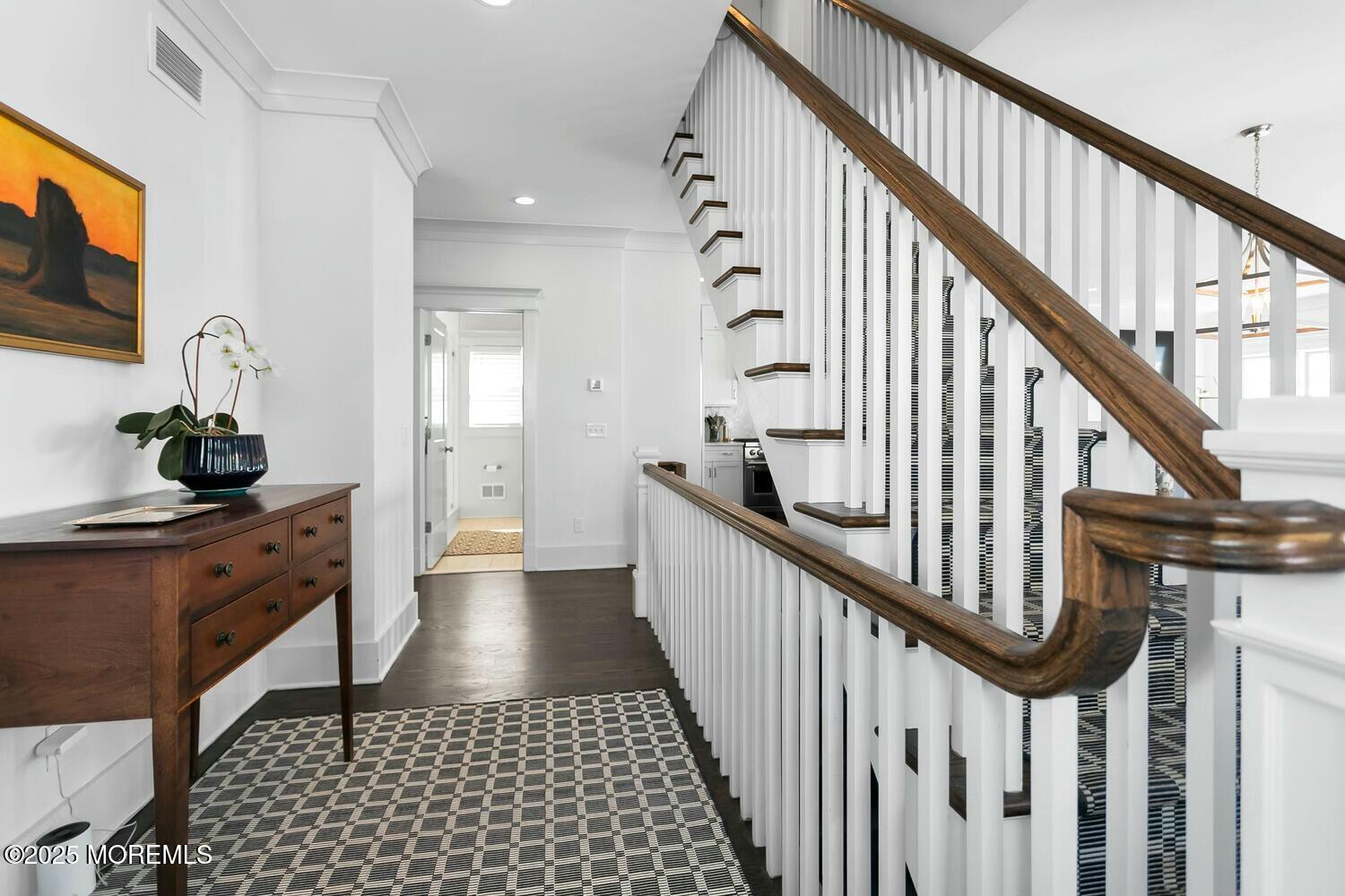 20 Riverview Place Sea Bright, NJ 07760 - Photo 28 of 107 a view of a hallway with wooden floor and staircase