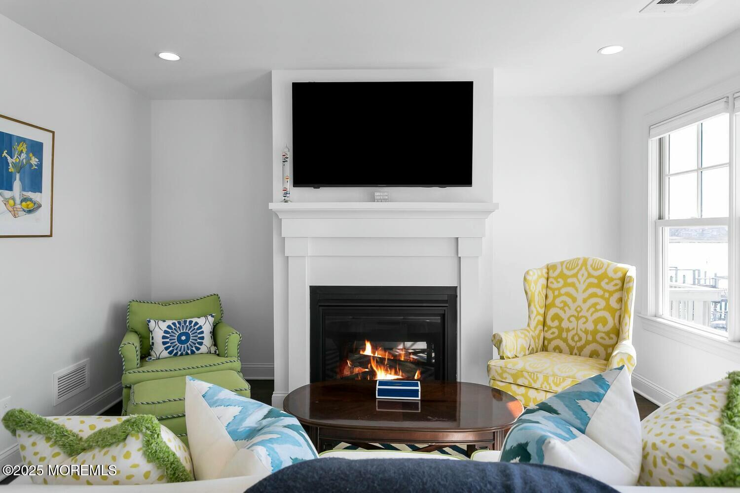 20 Riverview Place Sea Bright, NJ 07760 - Photo 35 of 107 a living room with furniture a fireplace and a flat screen tv