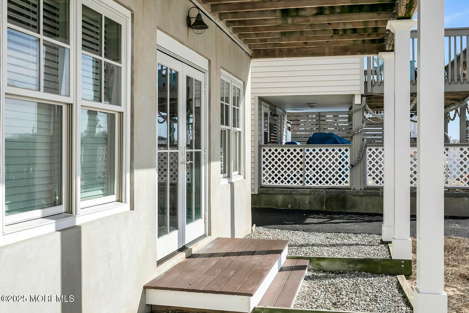 20 Riverview Place Sea Bright, NJ 07760 - Photo 66 of 107 a view of a balcony with a door and wooden bench