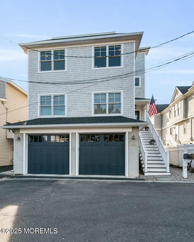 20 Riverview Place Sea Bright, NJ 07760 - Photo 97 of 107 a front view of a house with a garage and a window