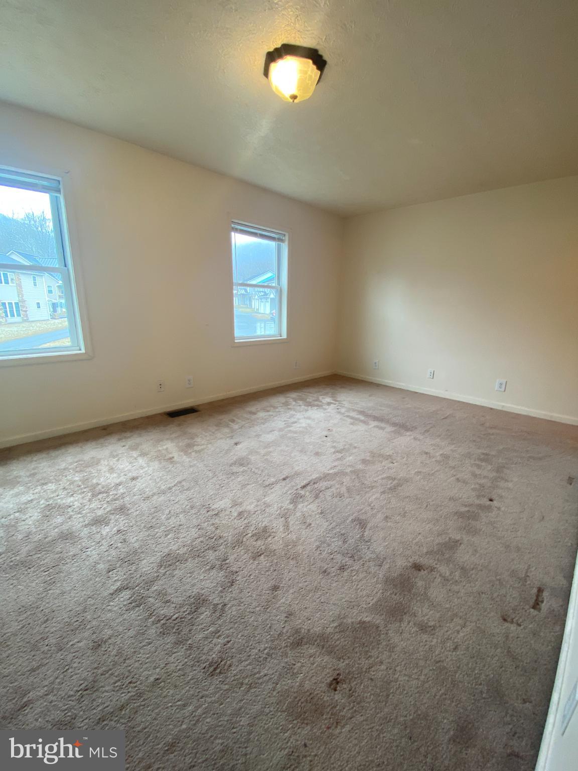 28 Holler Road, Unit 3 Keyser, WV 26726 - Photo 14 of 23 an empty room with windows