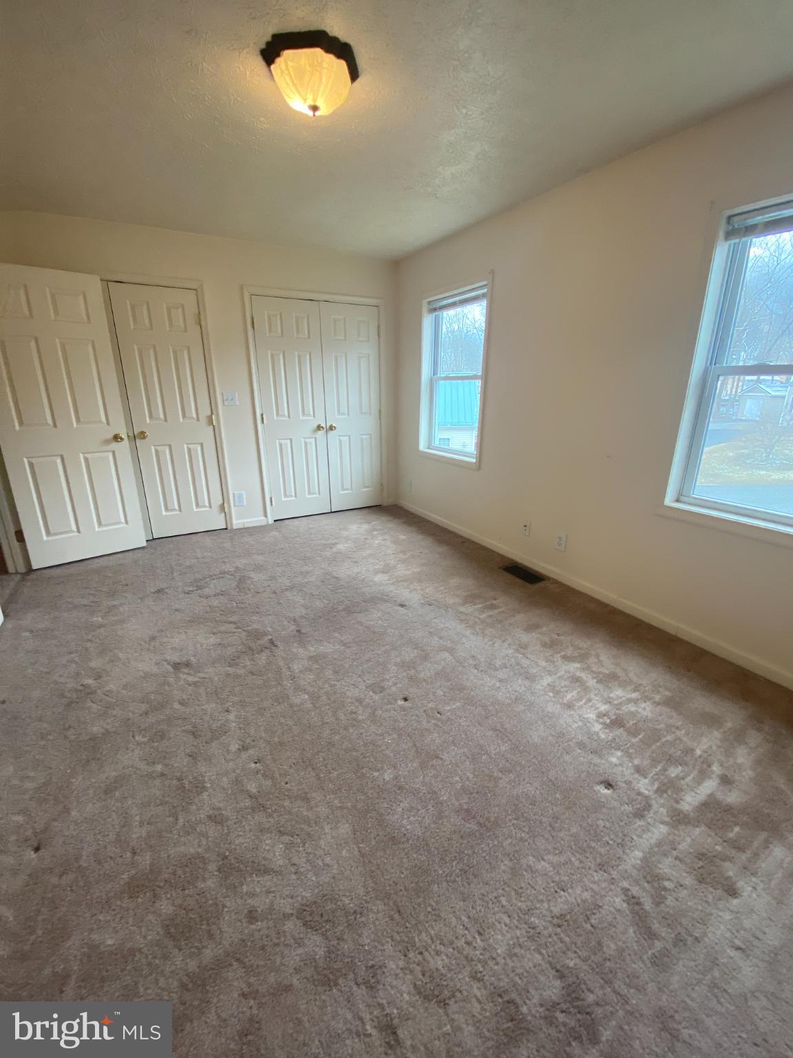 28 Holler Road, Unit 3 Keyser, WV 26726 - Photo 15 of 23 an empty room with windows