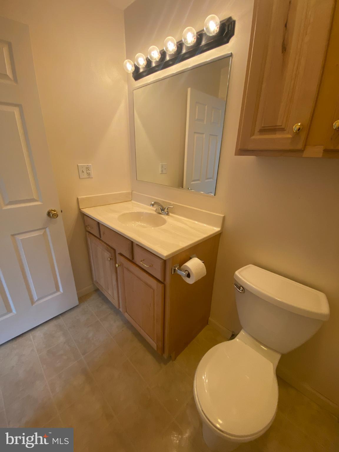 28 Holler Road, Unit 3 Keyser, WV 26726 - Photo 16 of 23 a bathroom with a toilet sink and mirror
