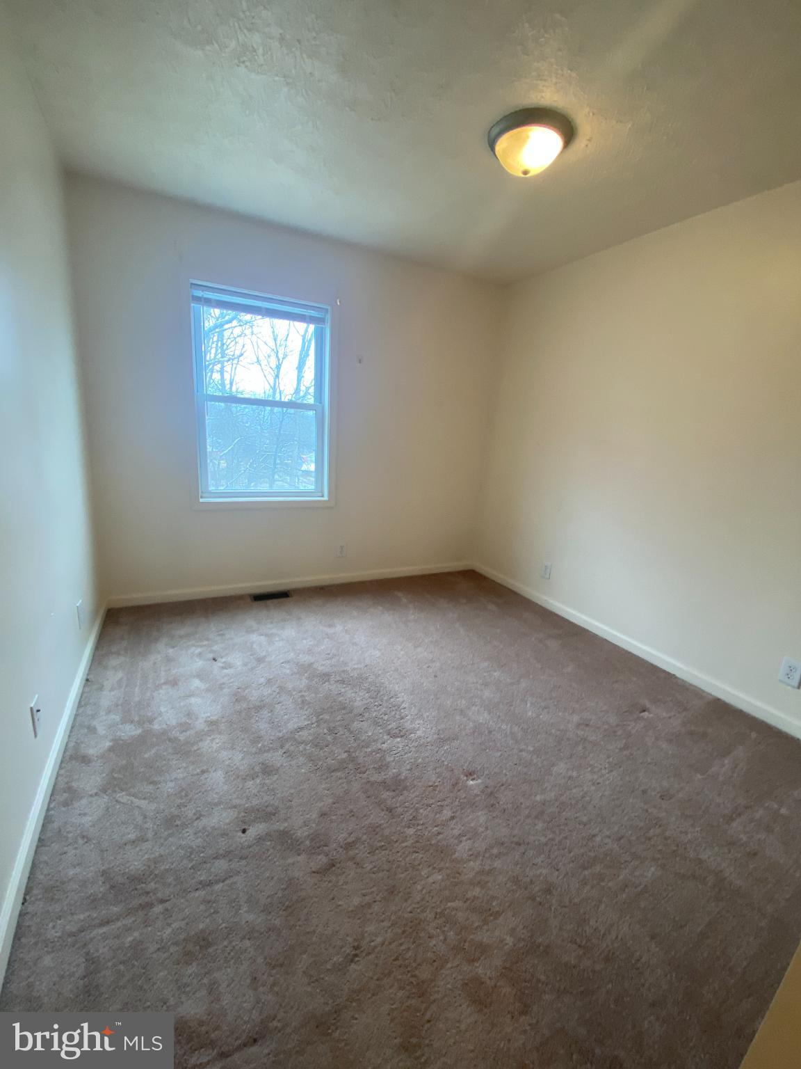 28 Holler Road, Unit 3 Keyser, WV 26726 - Photo 20 of 23 an empty room with a window