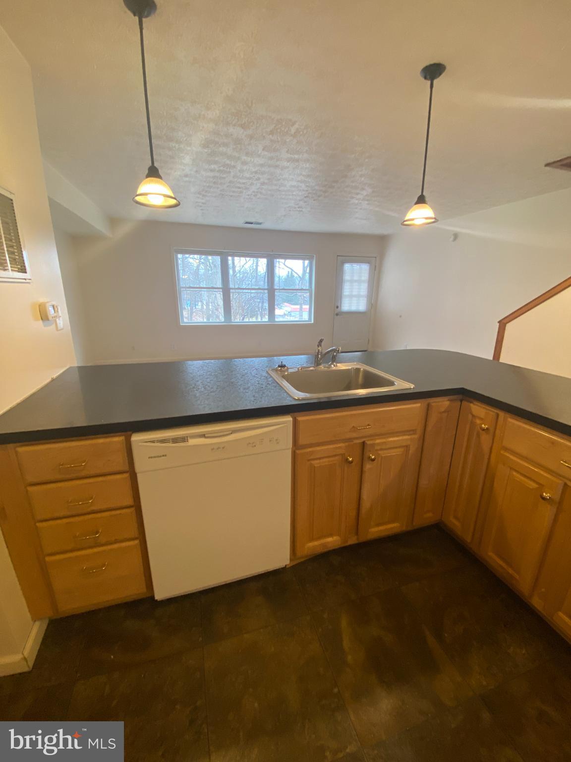 28 Holler Road, Unit 3 Keyser, WV 26726 - Photo 4 of 23 a kitchen with a sink and cabinets