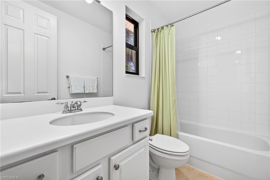 1248 Manado Drive Naples, FL 34113 - Photo 22 of 45 a bathroom with a sink toilet and shower