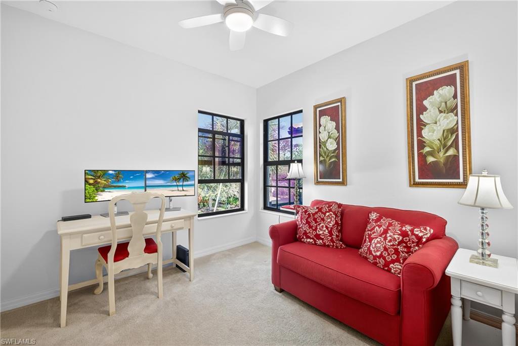 1248 Manado Drive Naples, FL 34113 - Photo 23 of 45 a living room with furniture and a large window
