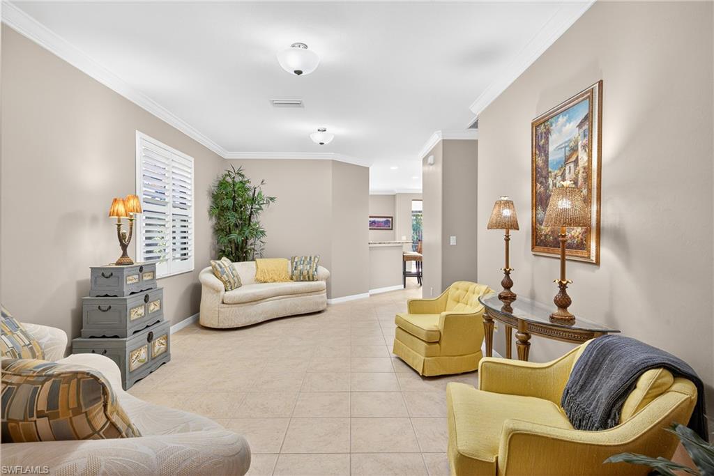 1248 Manado Drive Naples, FL 34113 - Photo 4 of 45 a living room with furniture and a large window