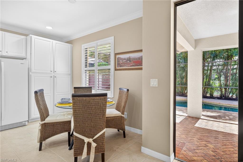 1248 Manado Drive Naples, FL 34113 - Photo 10 of 45 a view of a dining room with furniture window and outside view
