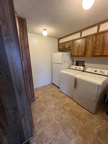 a view of a house with backyard sitting area and garden