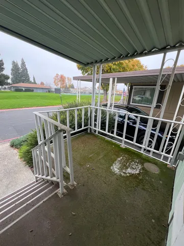 a view of a swimming pool with a patio