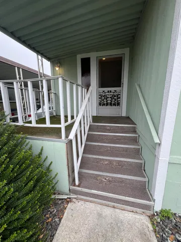 a view of a porch with furniture