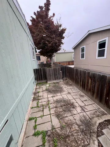 a view of backyard with green space